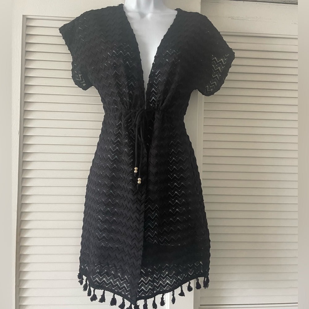 Bathing suit cover up. Drawstring and round tassels.